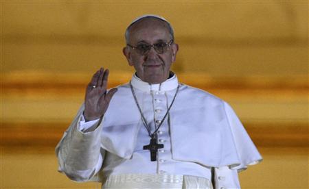 Newly elected Pope Francis, Cardinal Jorge Mario Bergoglio of Argentina appears on the balcony of St. Peter's Basilica after being elected by the conclave of cardinals, at the Vatican, March 13, 2013. REUTERS/Dylan Martinez